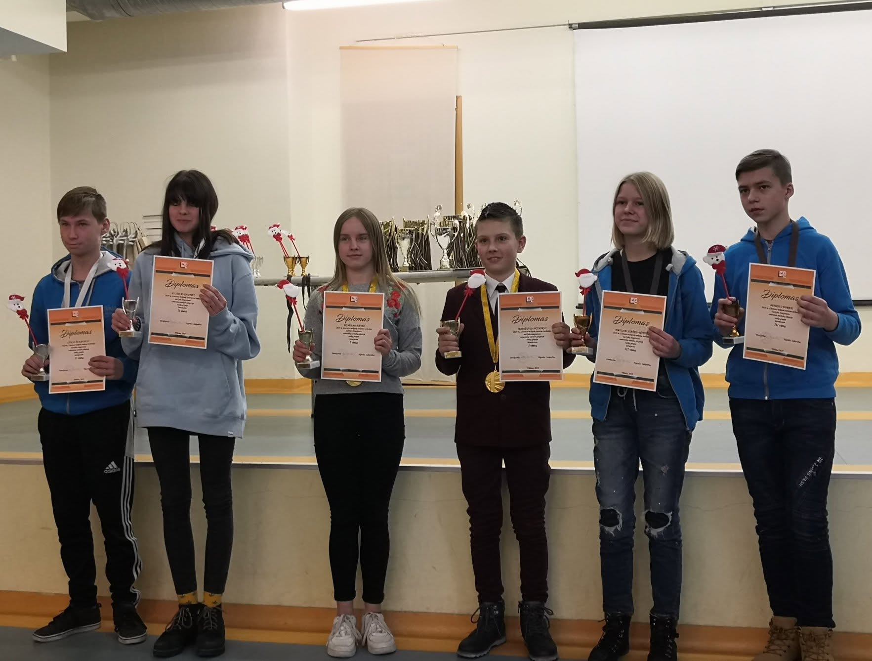 Young athletes with diplomas